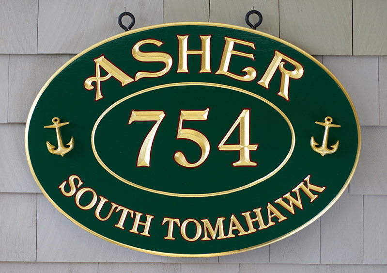 home sign with carved anchors