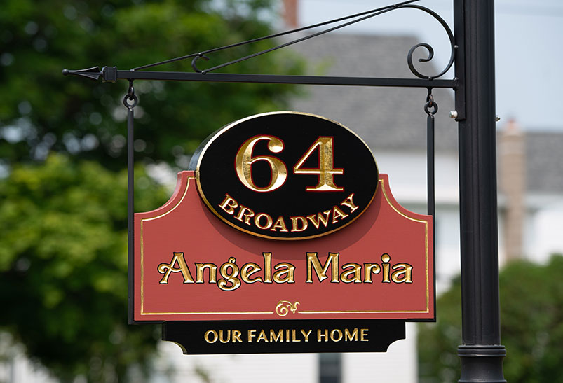 This carved home sign was created for a Victorian Mansion and features carved and 23k gold leaf letters