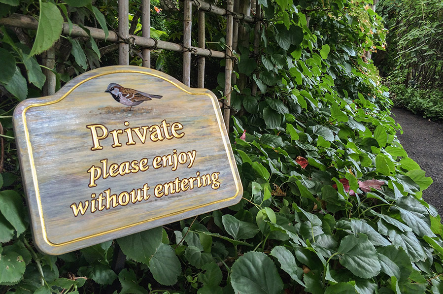 Privacy sign for a pathway encouraging enjoyment without entering