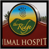 The Ridge Vetinary Hospital sign in Sanford, Maine has two panels and a top circle that extrudes beyond the lower portion of the sign.