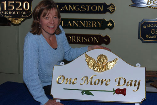 Sandra Freeman displays a unique sign for a special customer with special circumstances