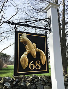 carved lobster with number gilded in gold leaf